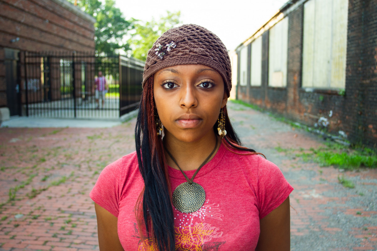 girl standing in alley