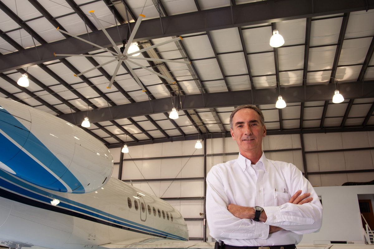 Aeronautical engineer standing in front of jet